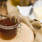 glass-jar-full-honey-with-honey-spoon