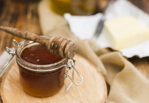 glass-jar-full-honey-with-honey-spoon